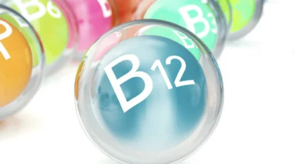 A close-up of a translucent sphere labeled "B12" with other similarly labeled spheres in the background, representing various B vitamins.