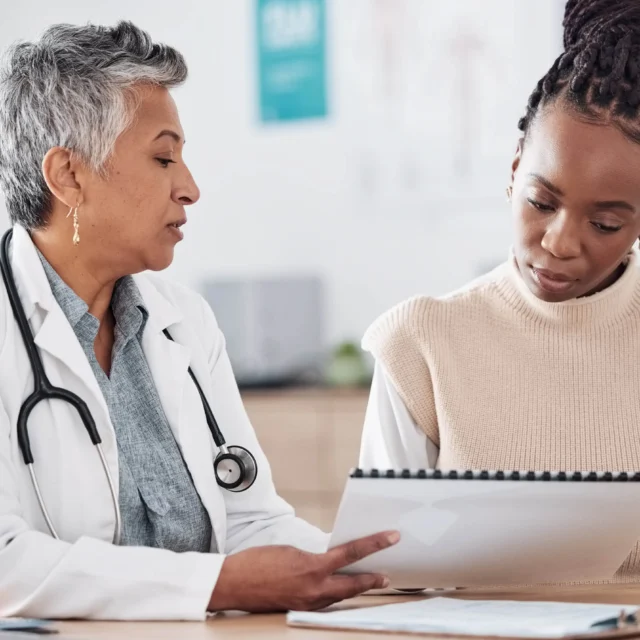 A doctor consulting a patient in hospital.