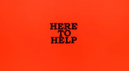 Black text reading "HERE TO HELP" is centered on a solid bright orange background.