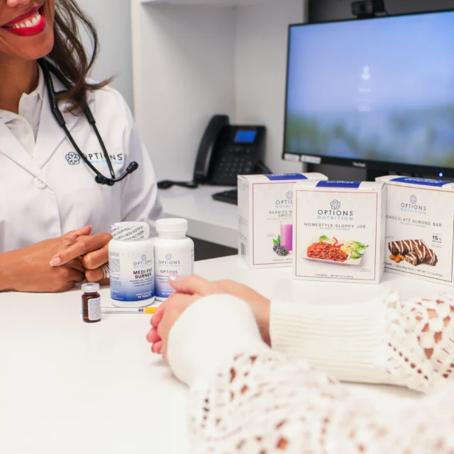 A consultation between a doctor and patient at Options Medical.