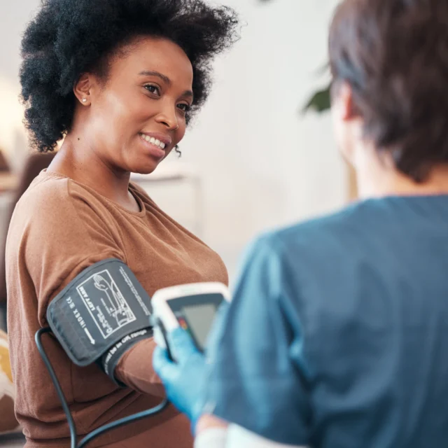 A patient getting their blood pressure checked.