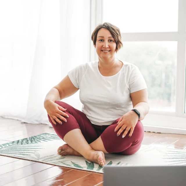 A woman practicing yoga.