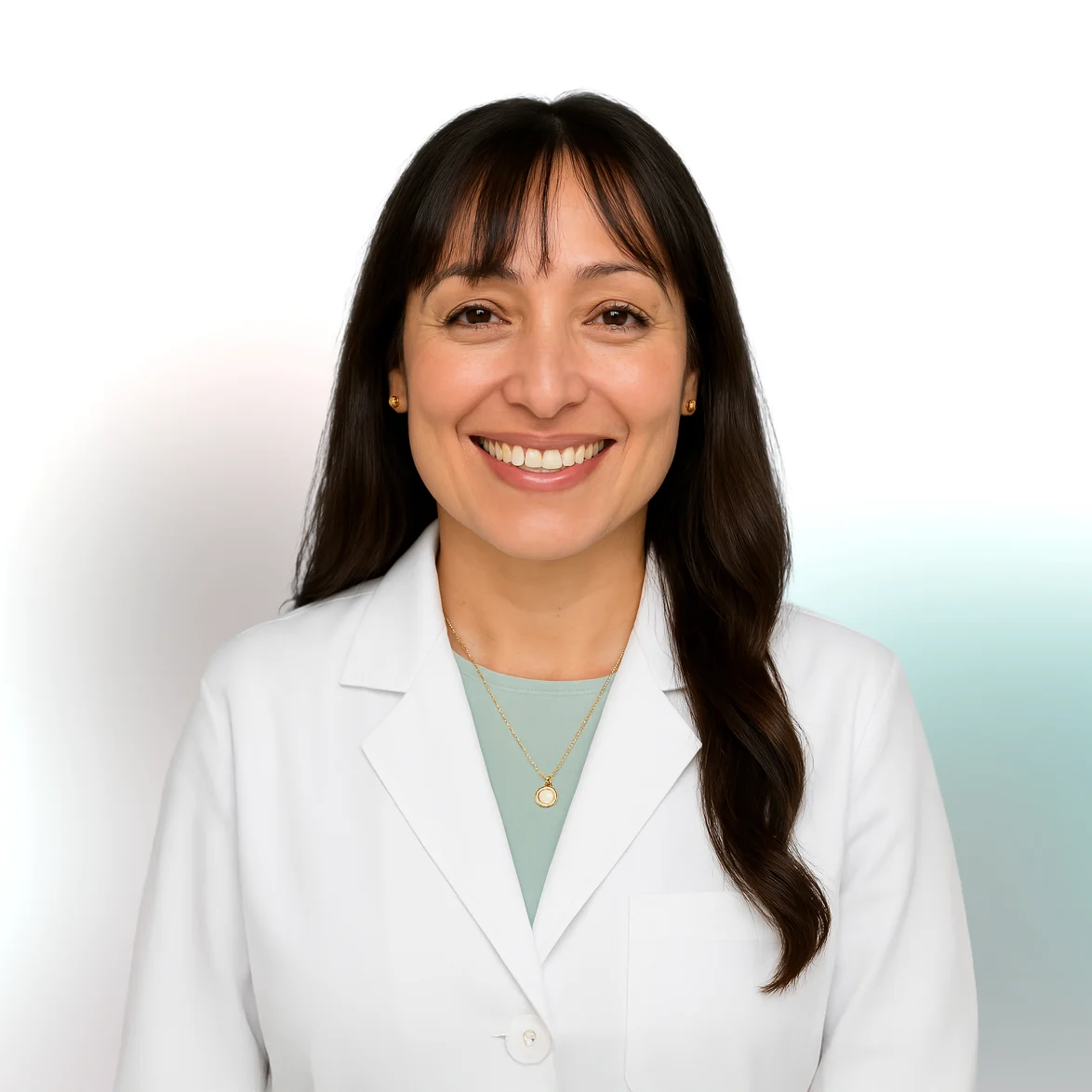 A woman in a white lab coat smiles at the camera against a plain background.